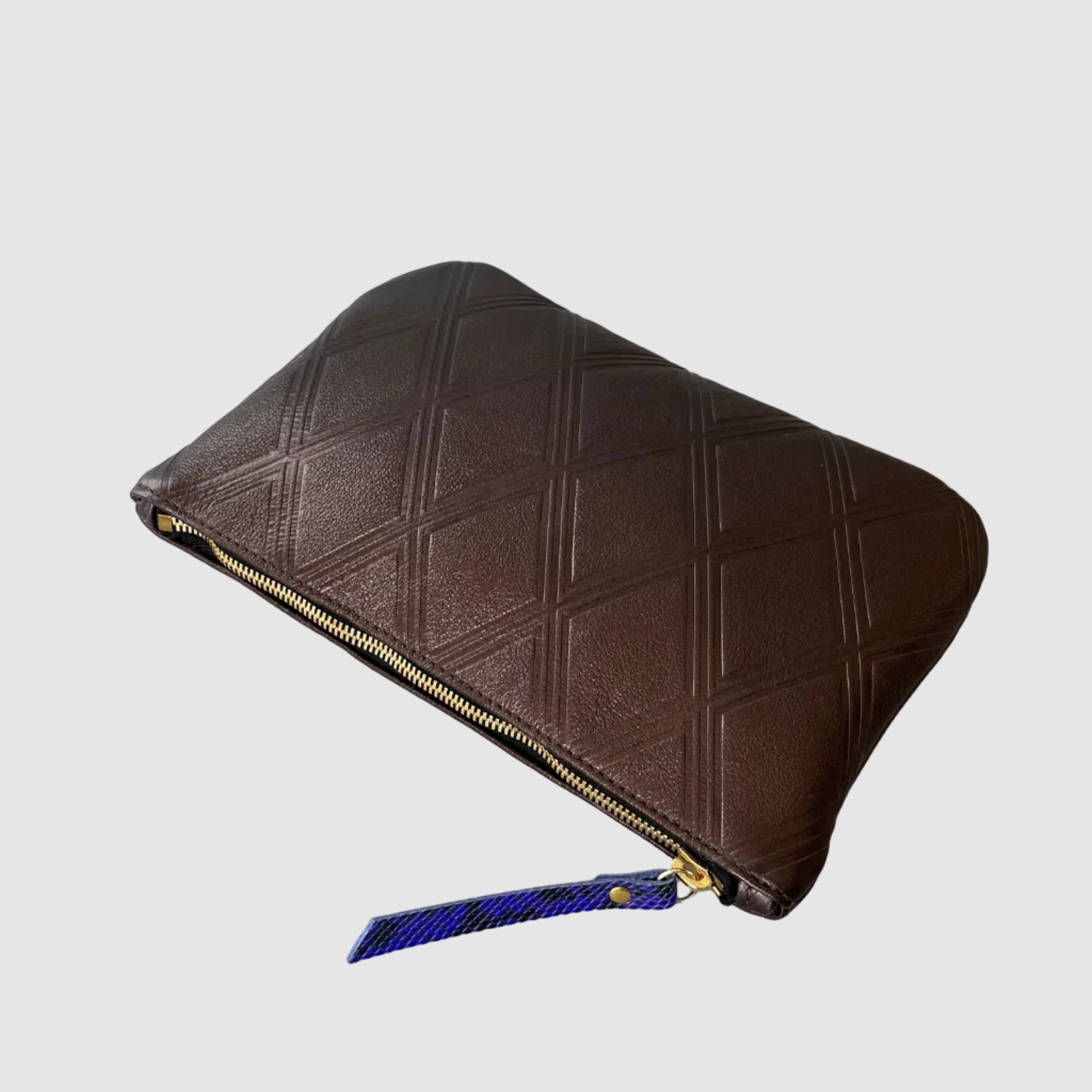 Medium sized clutch mellow dawn embossed diamond patterns quilted vibe independent hand made boutique