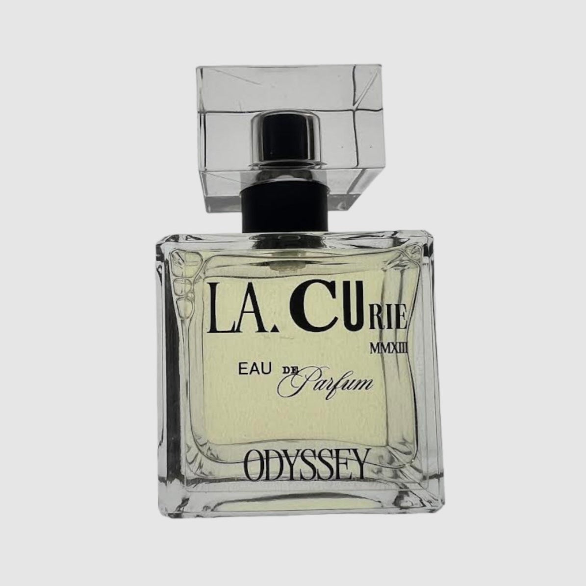 A square glass bottle of LA CURIE Eau de Parfum with a black spray nozzle. The label reads 'ODYSSEY' and the product is a unisex perfume.