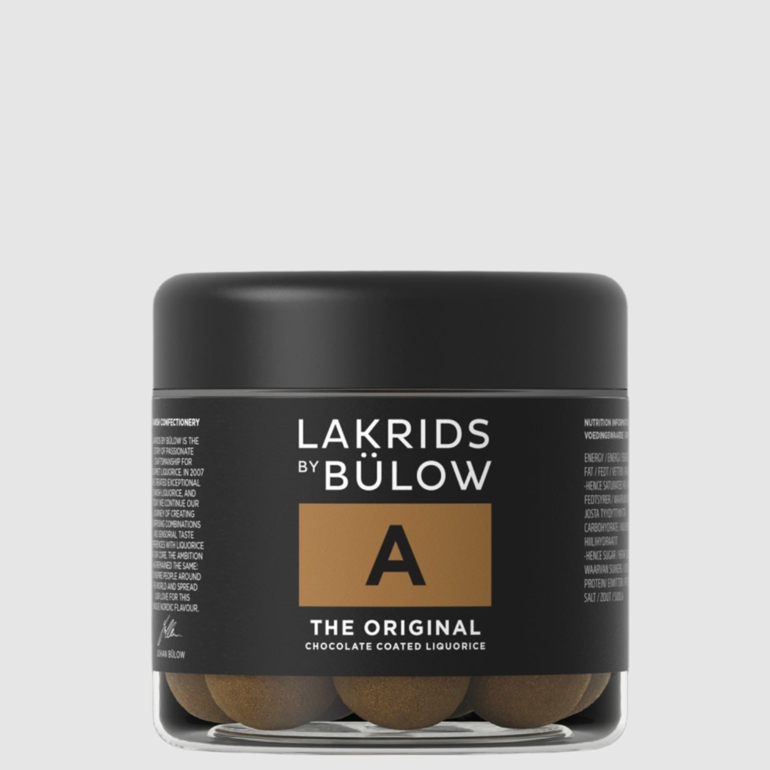 A container of Lakrids by Bulow A-Original flavored licorice pieces on a grey background.
