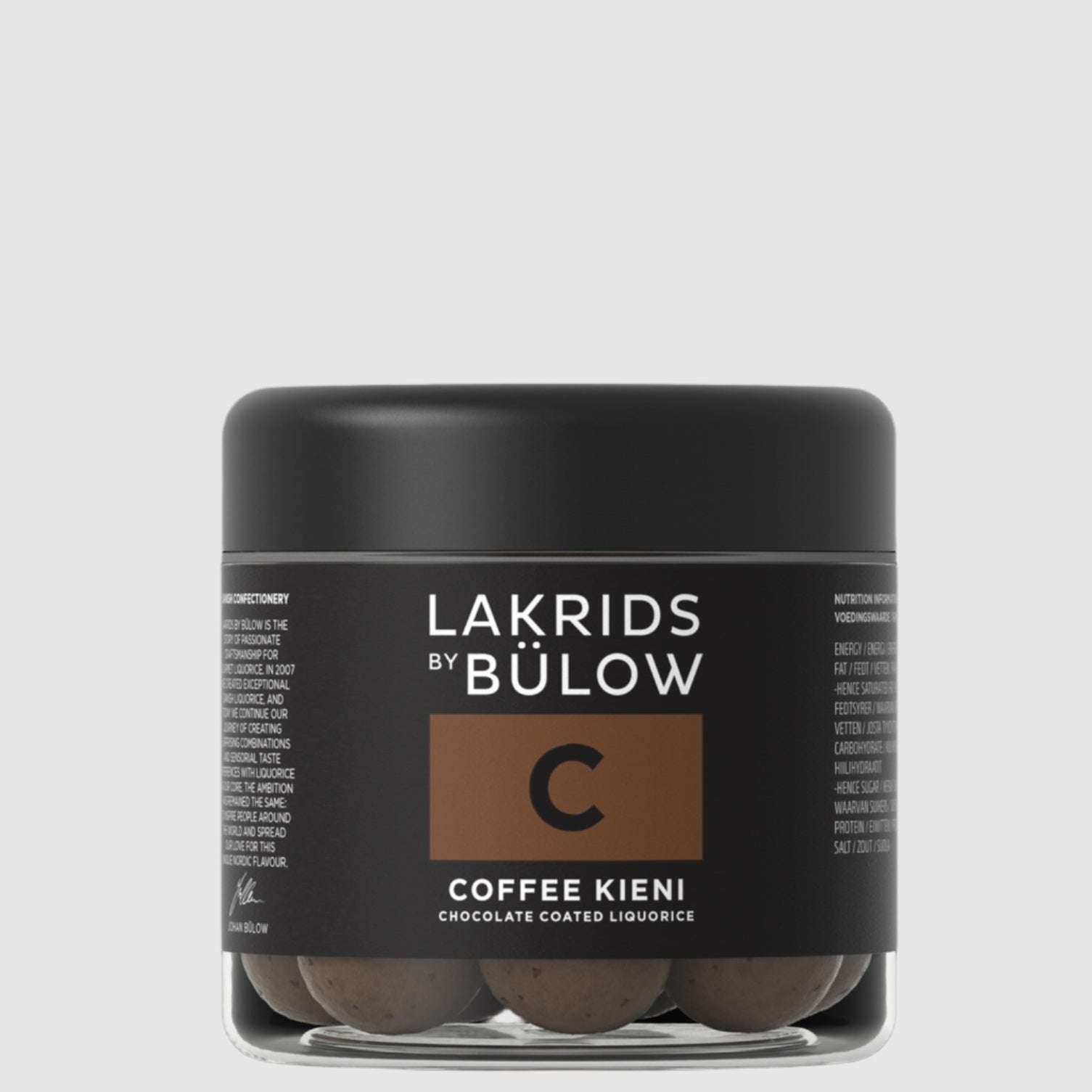 A container of Lakrids by Bulow C-Coffee Kieni flavored licorice pieces on a grey background.