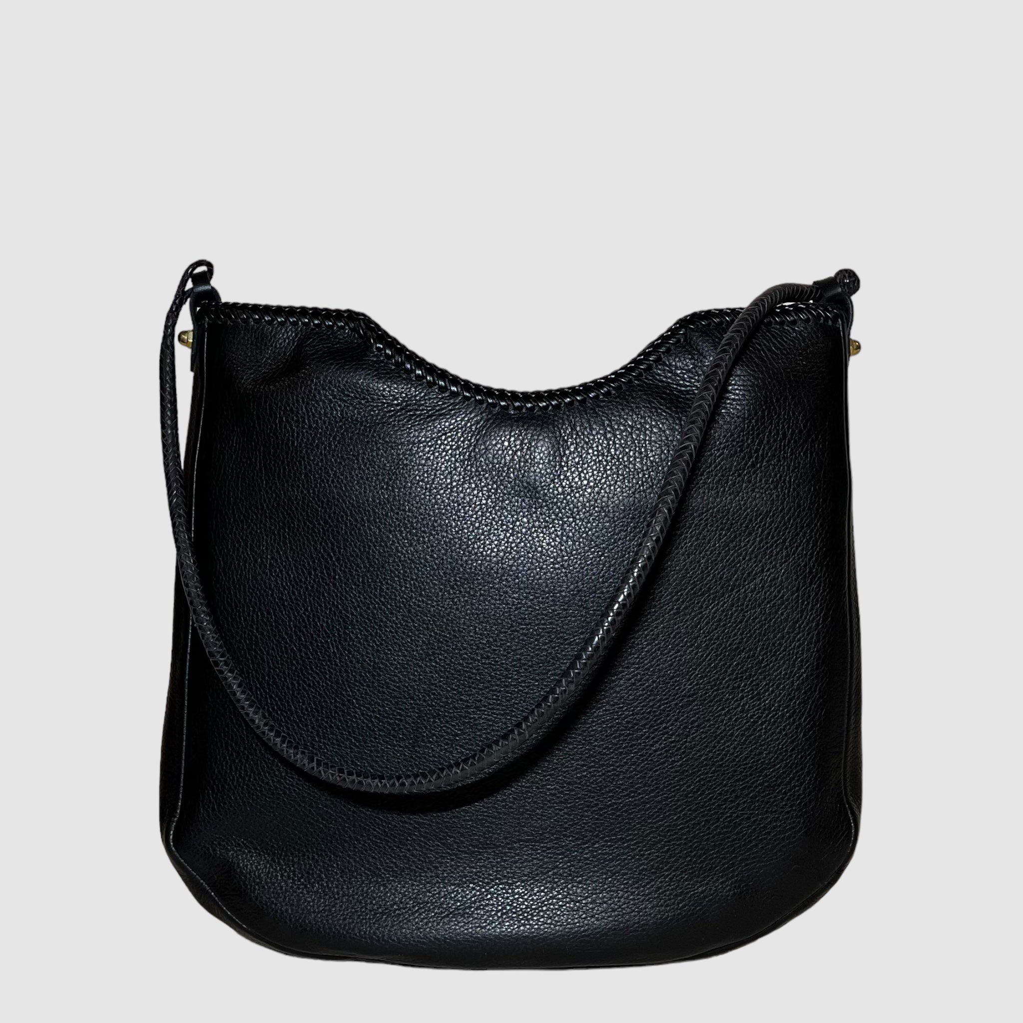 black leather with butter soft temper and medium structure, black leather lacing detail at top.
