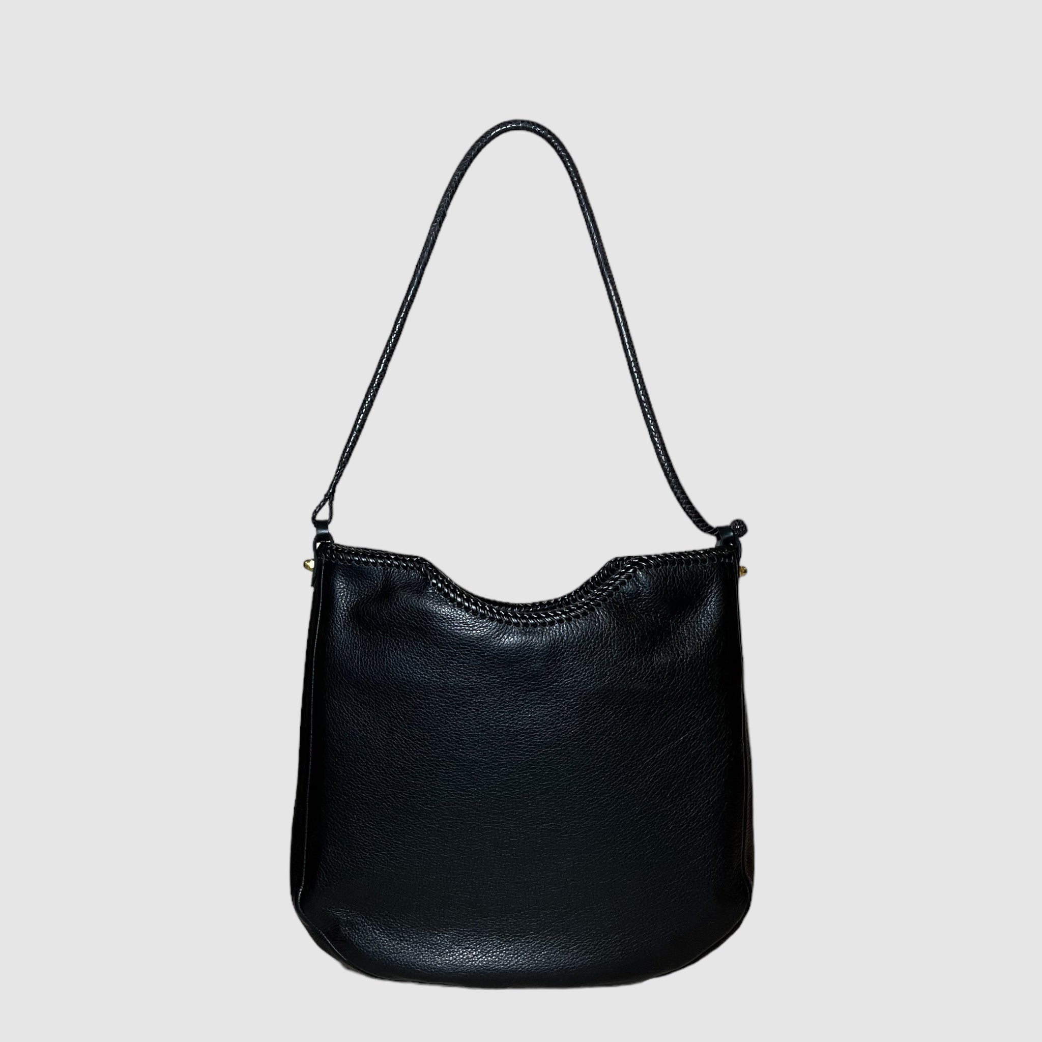 black leather with butter soft temper and medium structure
black leather lacing detail at top
black handwoven leather strap made in Mali with 10" drop
