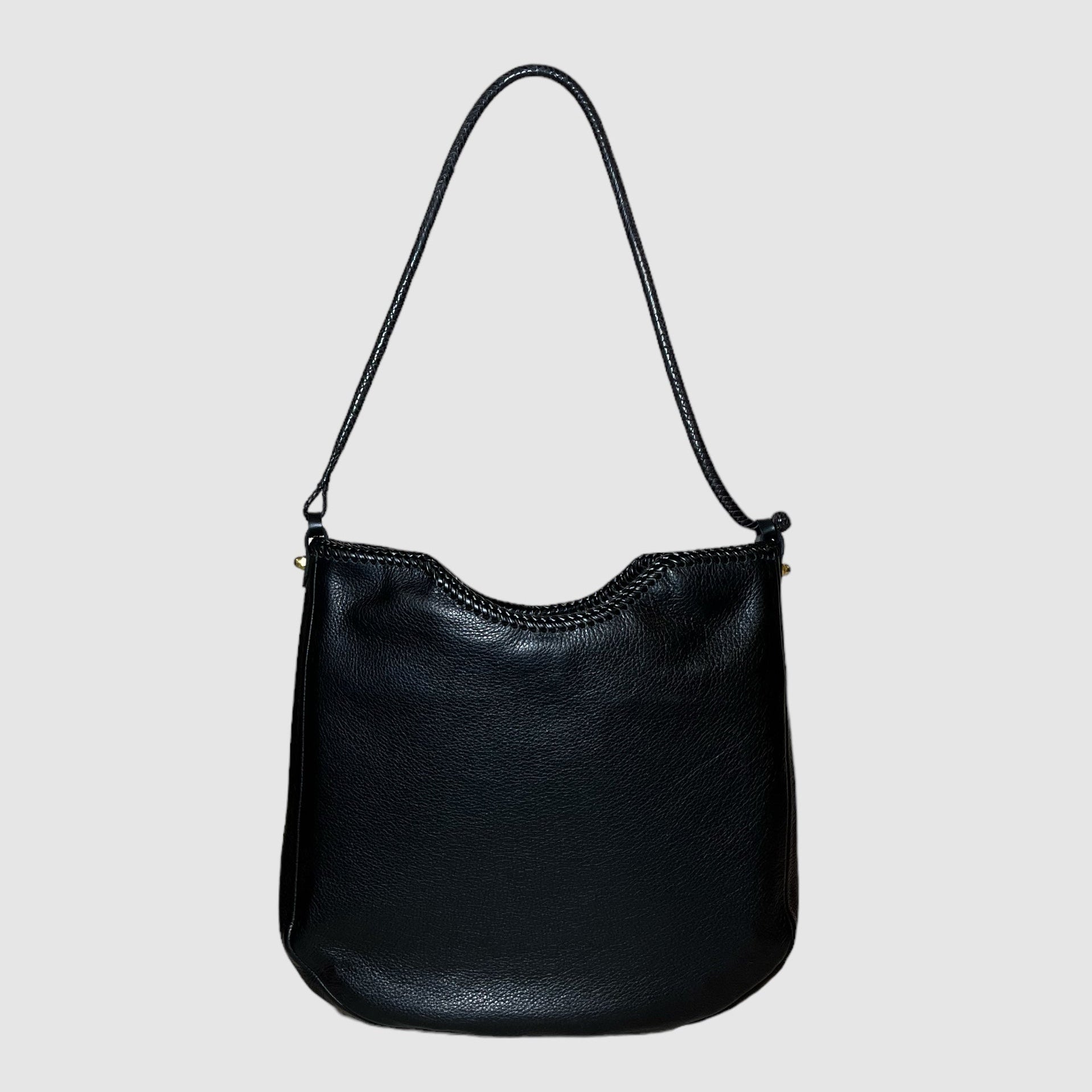 black leather with butter soft temper and medium structure
black leather lacing detail at top
black handwoven leather strap made in Mali with 10" drop