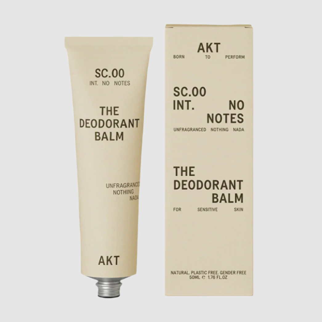 Deodorant balm tube and packaging on a beige background