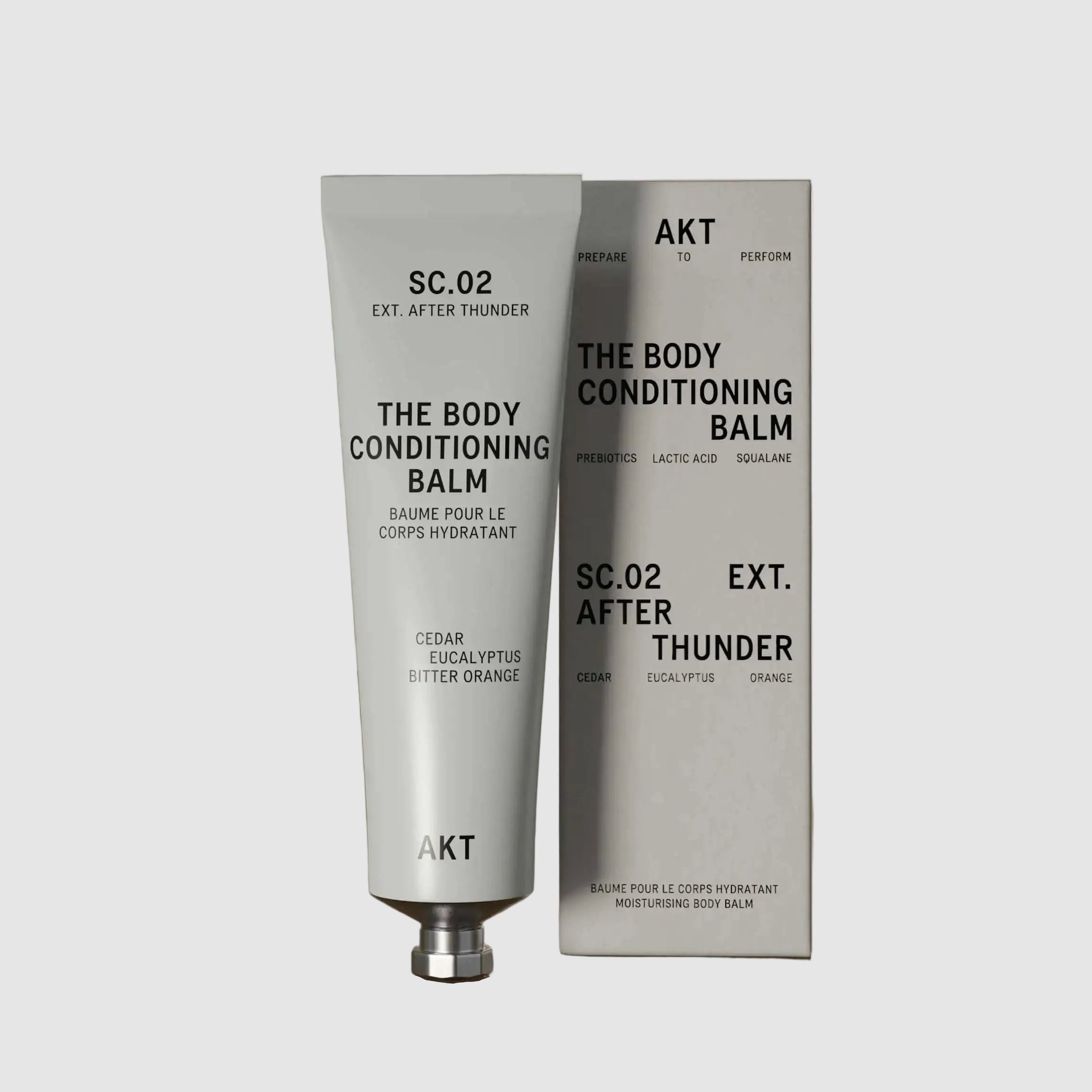 The AKT body conditioning balm with packaging on a neutral background