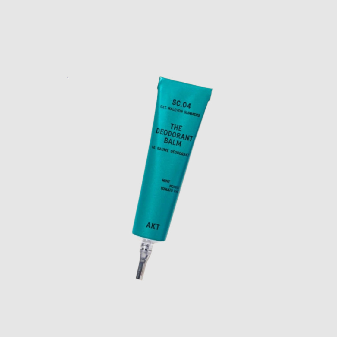 Teal deodorant balm tube on a light gray background