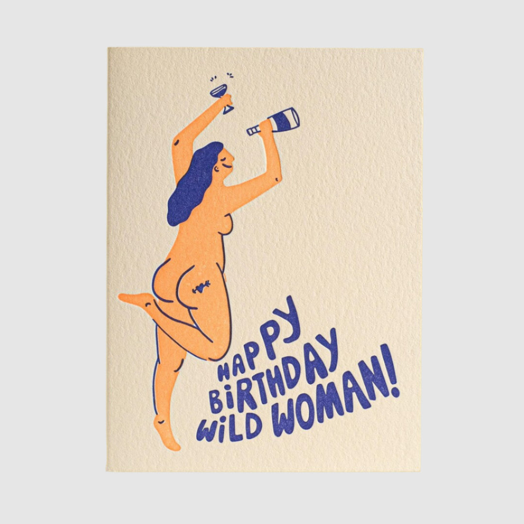 Greeting card with a stylized illustration of a woman and 'Happy Birthday Wild Woman!' text on a yellow background