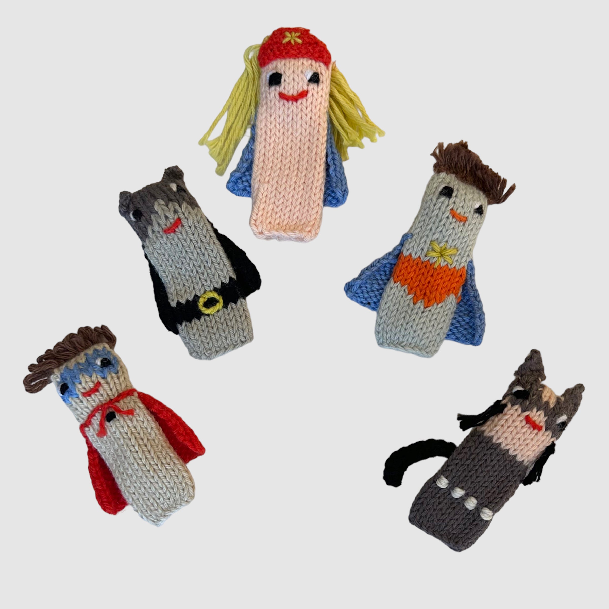 A set of five finger puppets designed as various superheroes, made from 100% cotton knit.