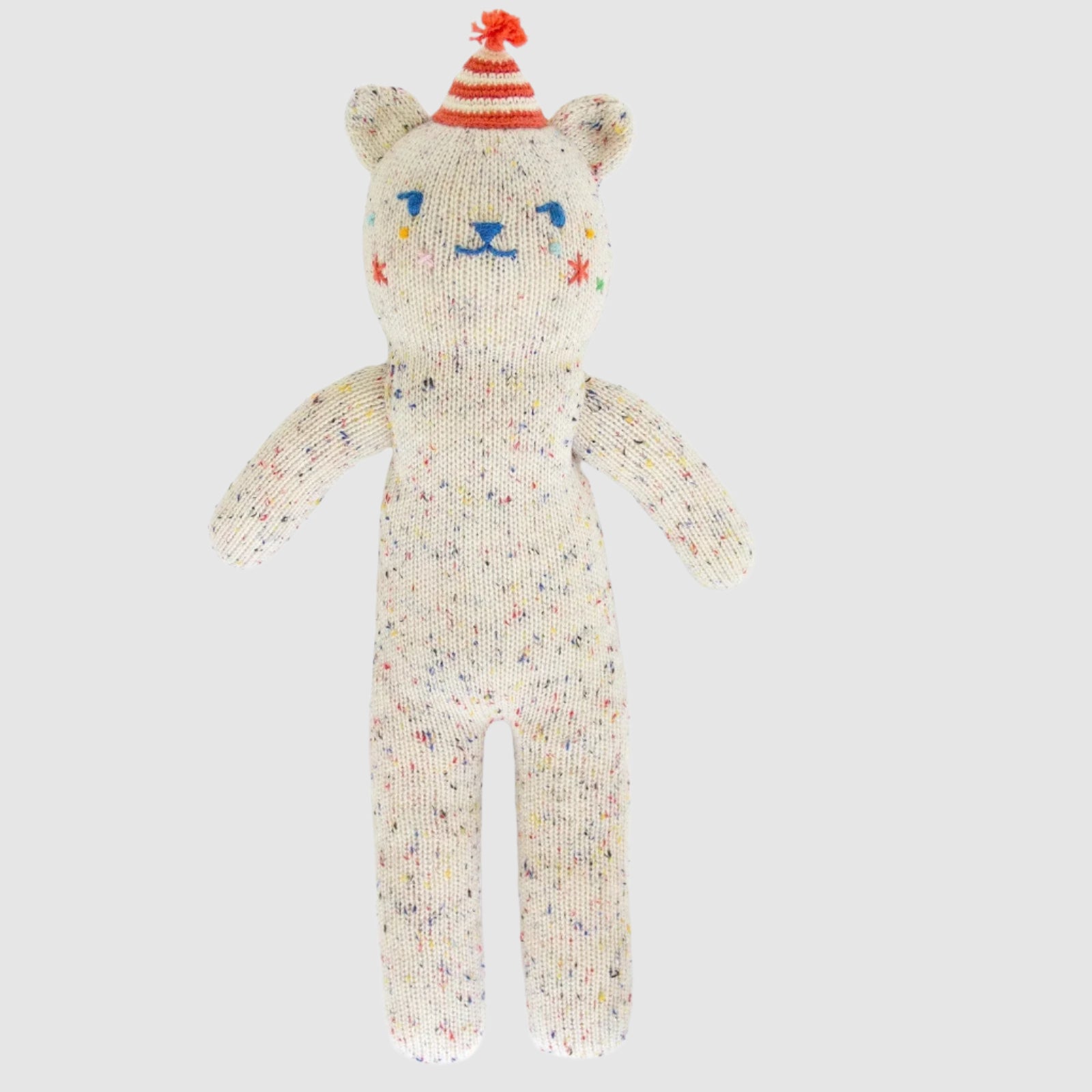 Knitted cat toy with a colorful hat on a white background