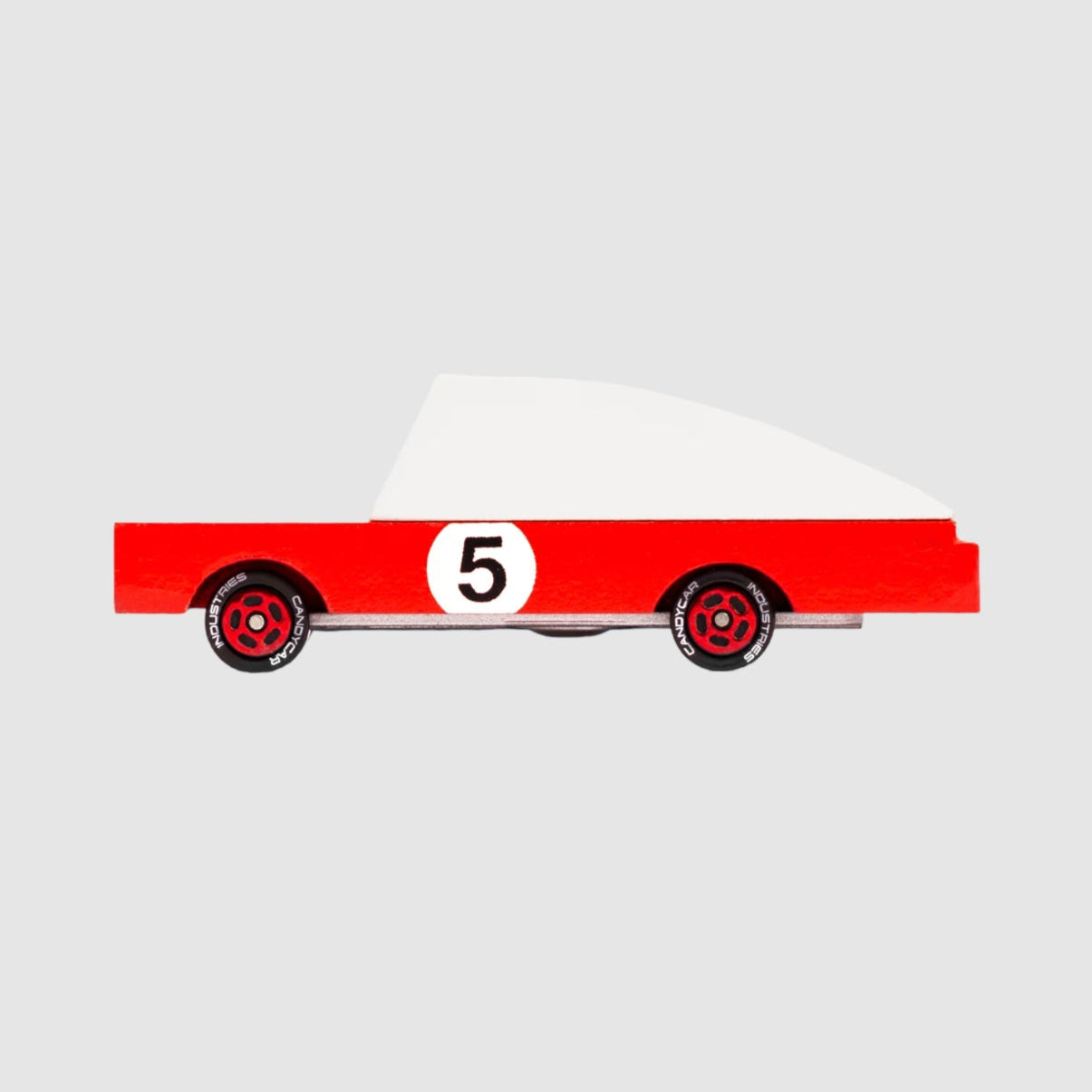 Red toy car with white top and number 5, on a light grey background