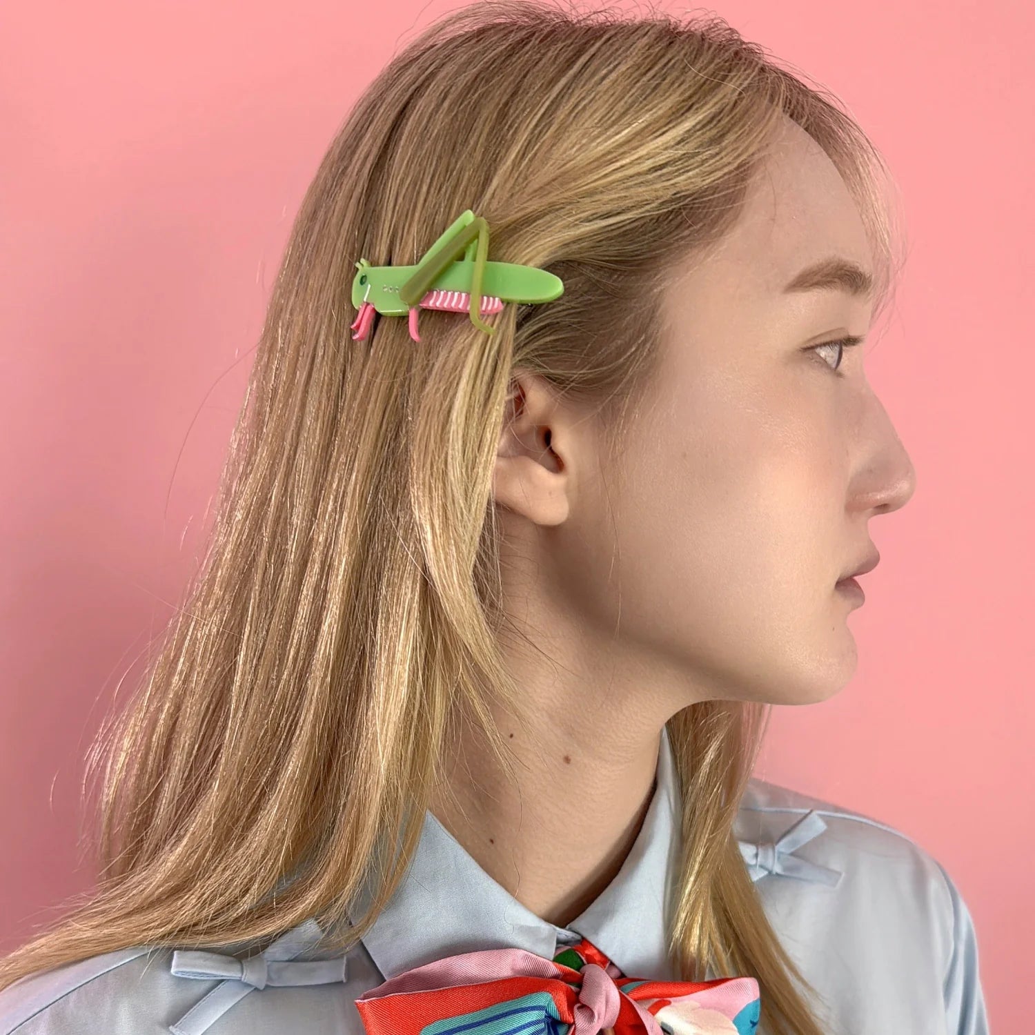 A 'cricket' style Centinelle barrette on a young person's hair