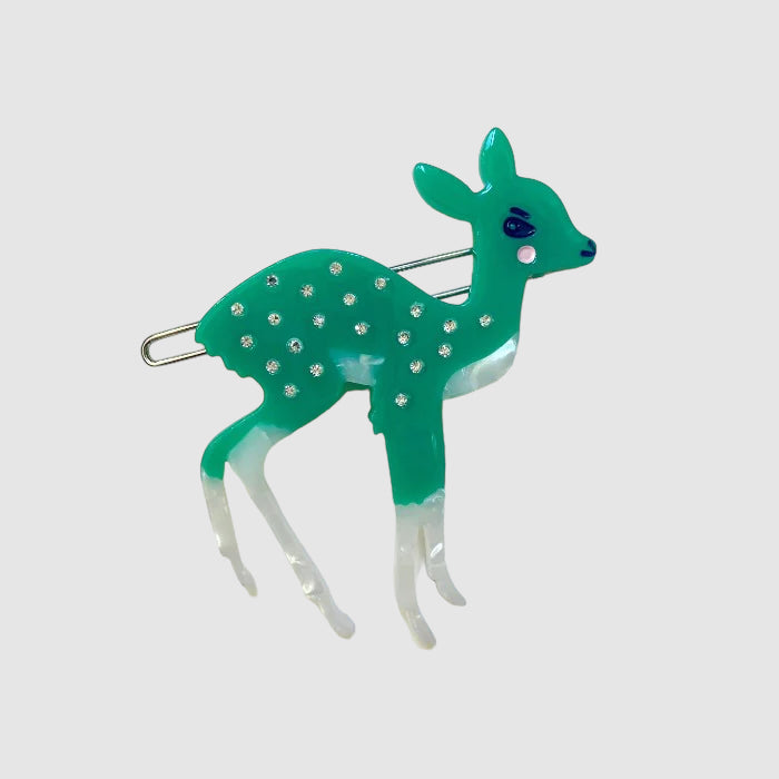 A green, Centinelle, deer barrette on a light grey background