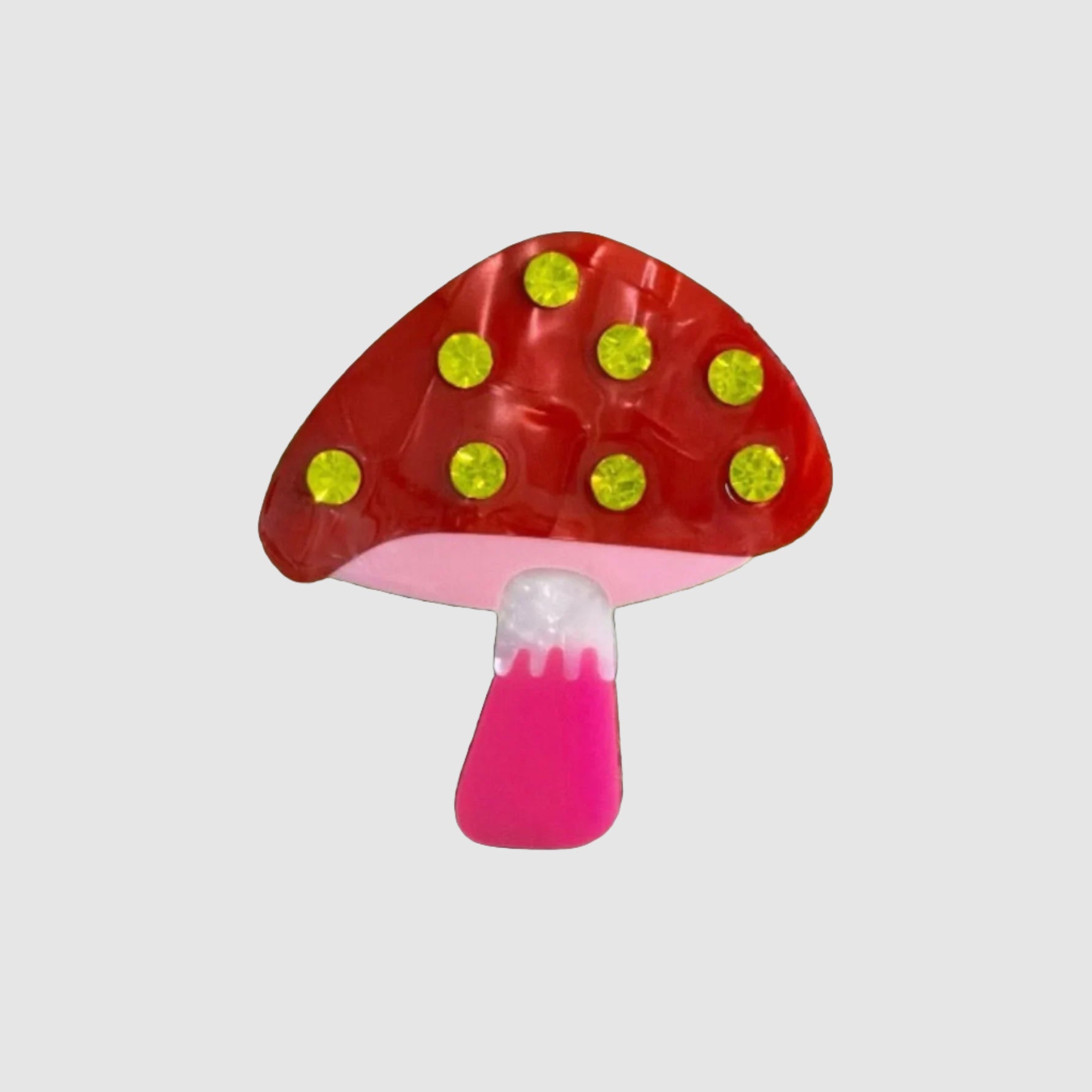 A Centinelle, 'mushroom' style barrette on a light grey background