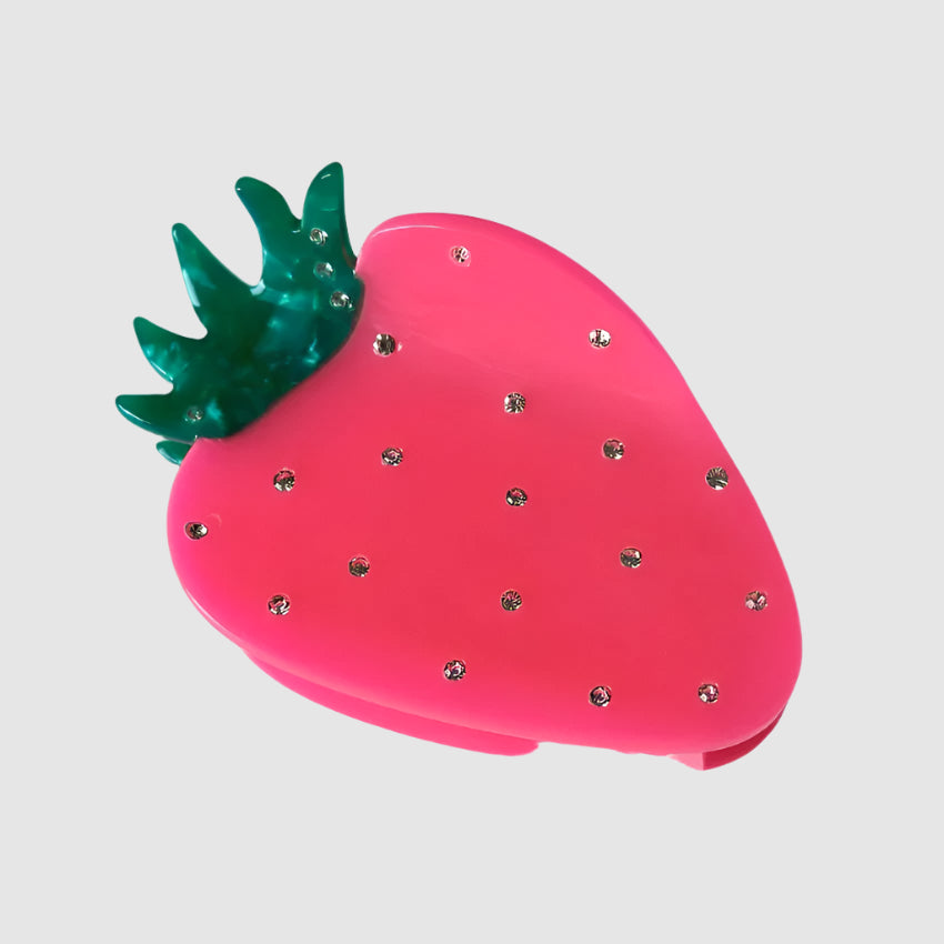 A 'neon strawberry' styled Centinelle hair claw clip on a light grey background
