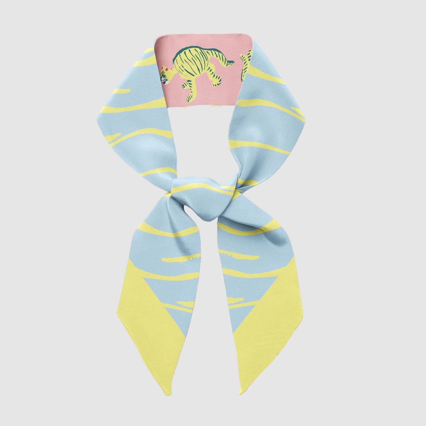 Centinelle's 'nodding tigers' twilly scarf in a knot. Light grey background.