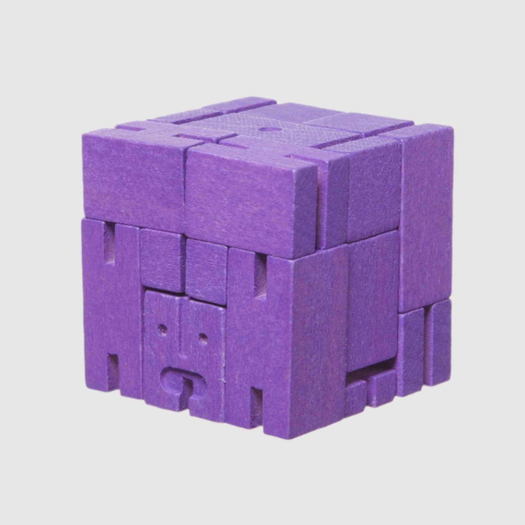 Purple wodden cube on a light grey background