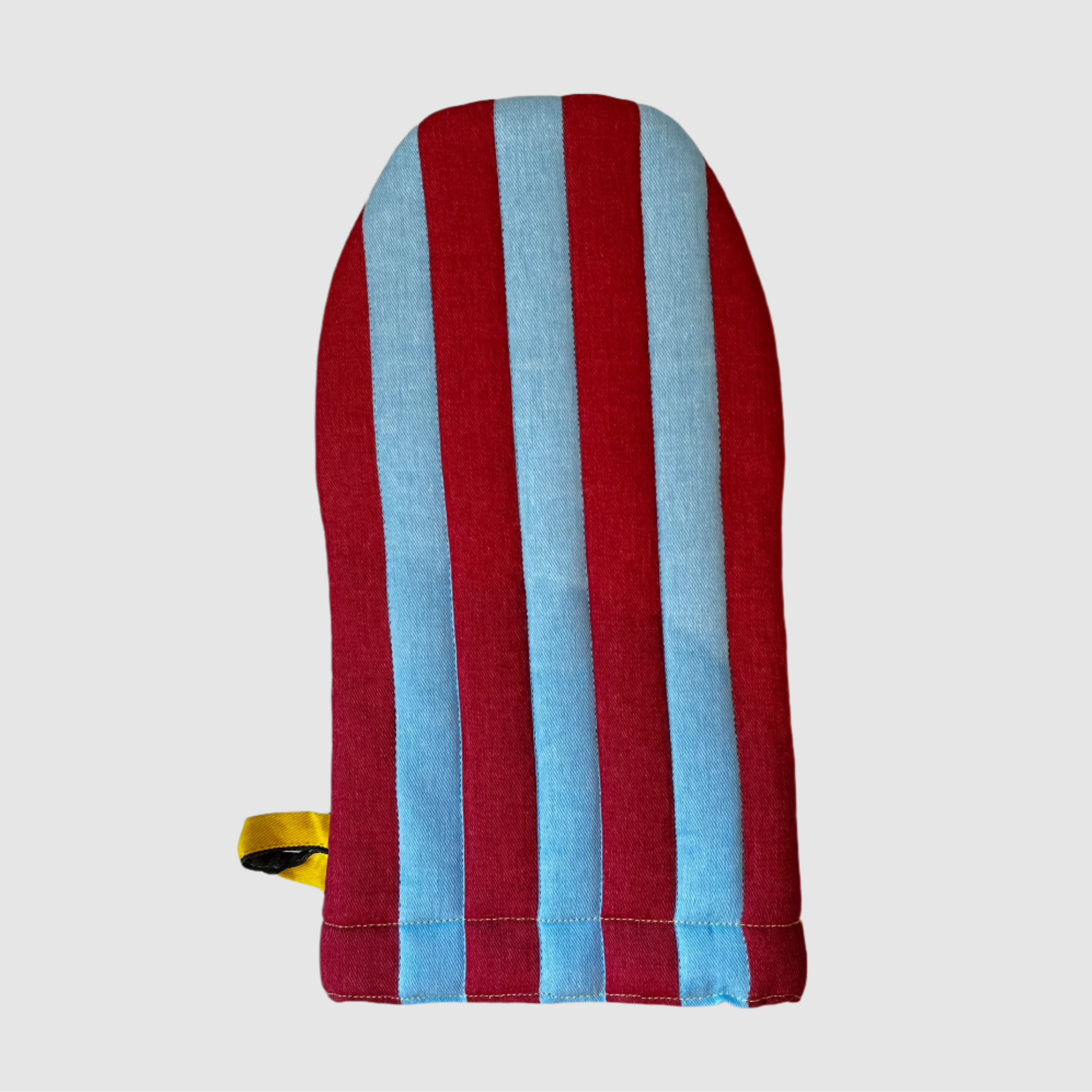 Oven mitt with red and blue stripes on a gray background