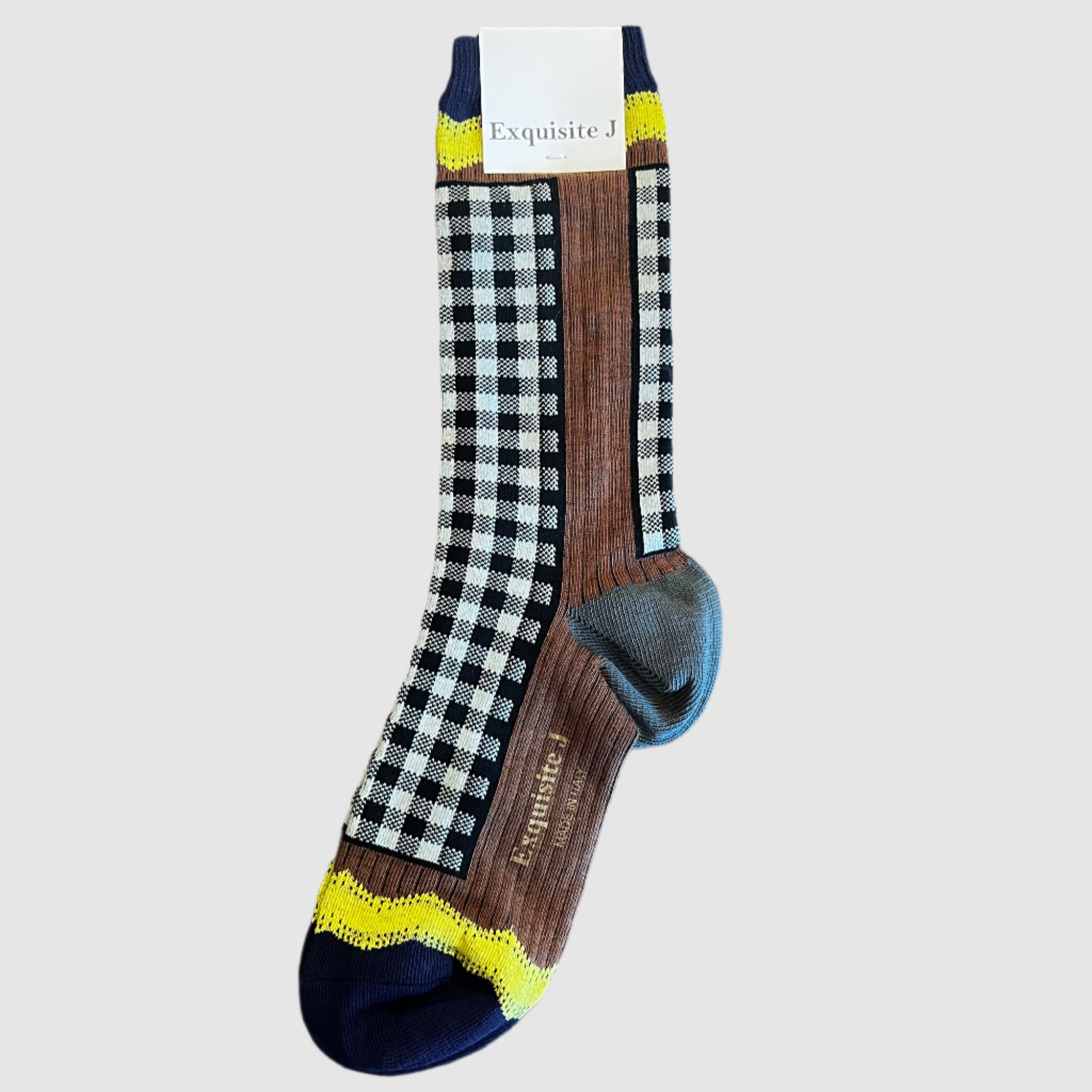 Pair of socks with checkered pattern on a wooden surface