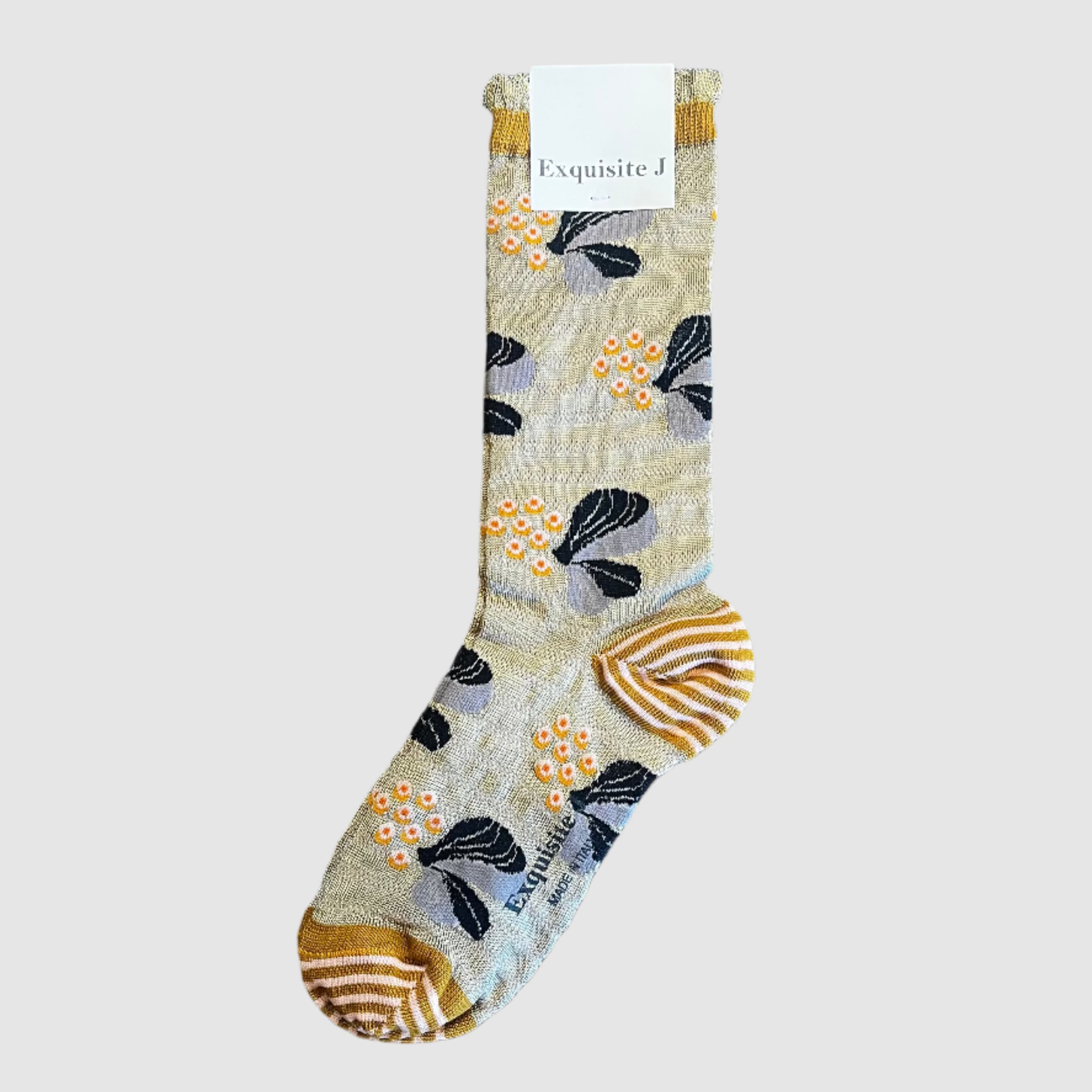 Floral-patterned sock on a light grey background with a visible brand tag.