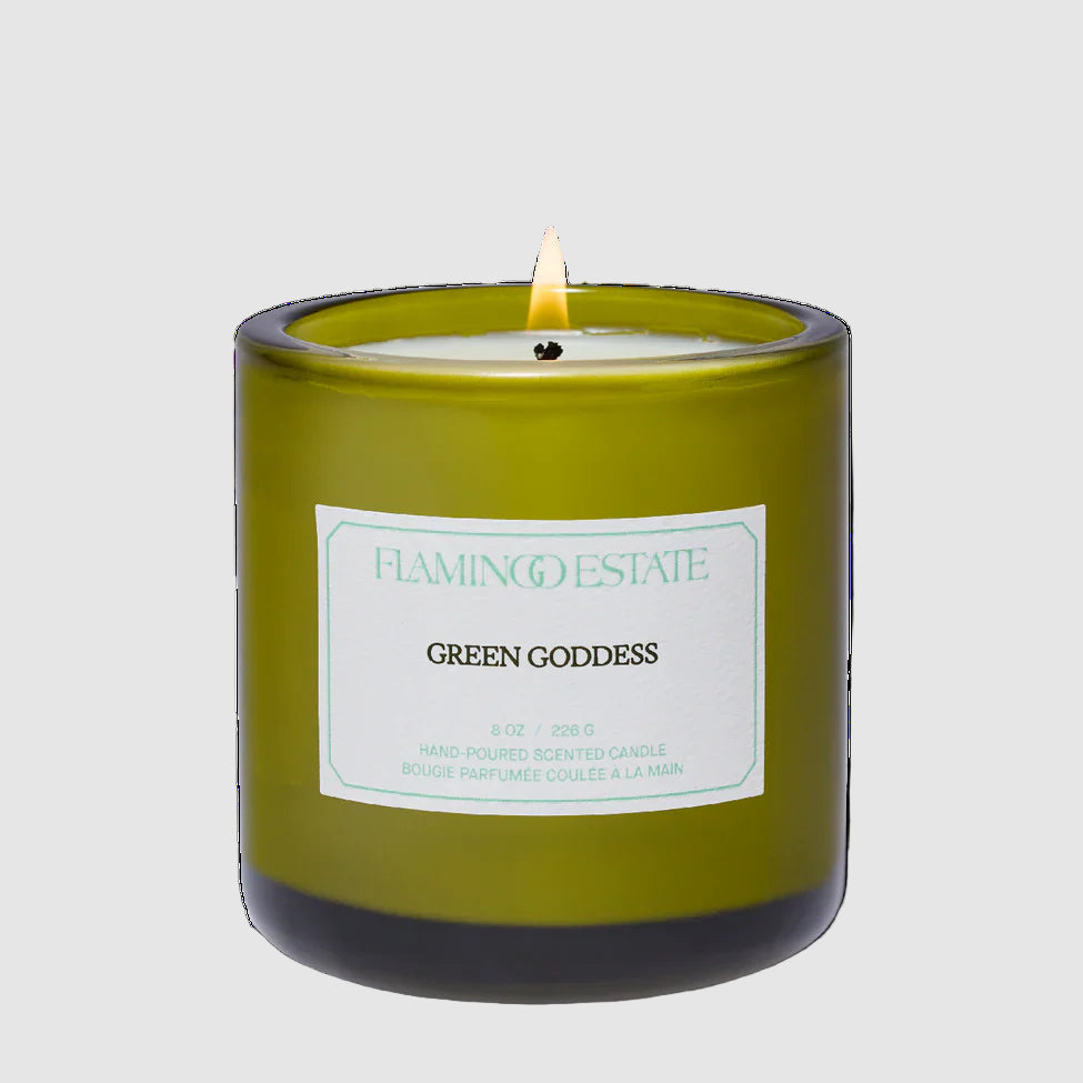 Green candle labeled 'Green Goddess' from Flamingo Estate on a light gray background
