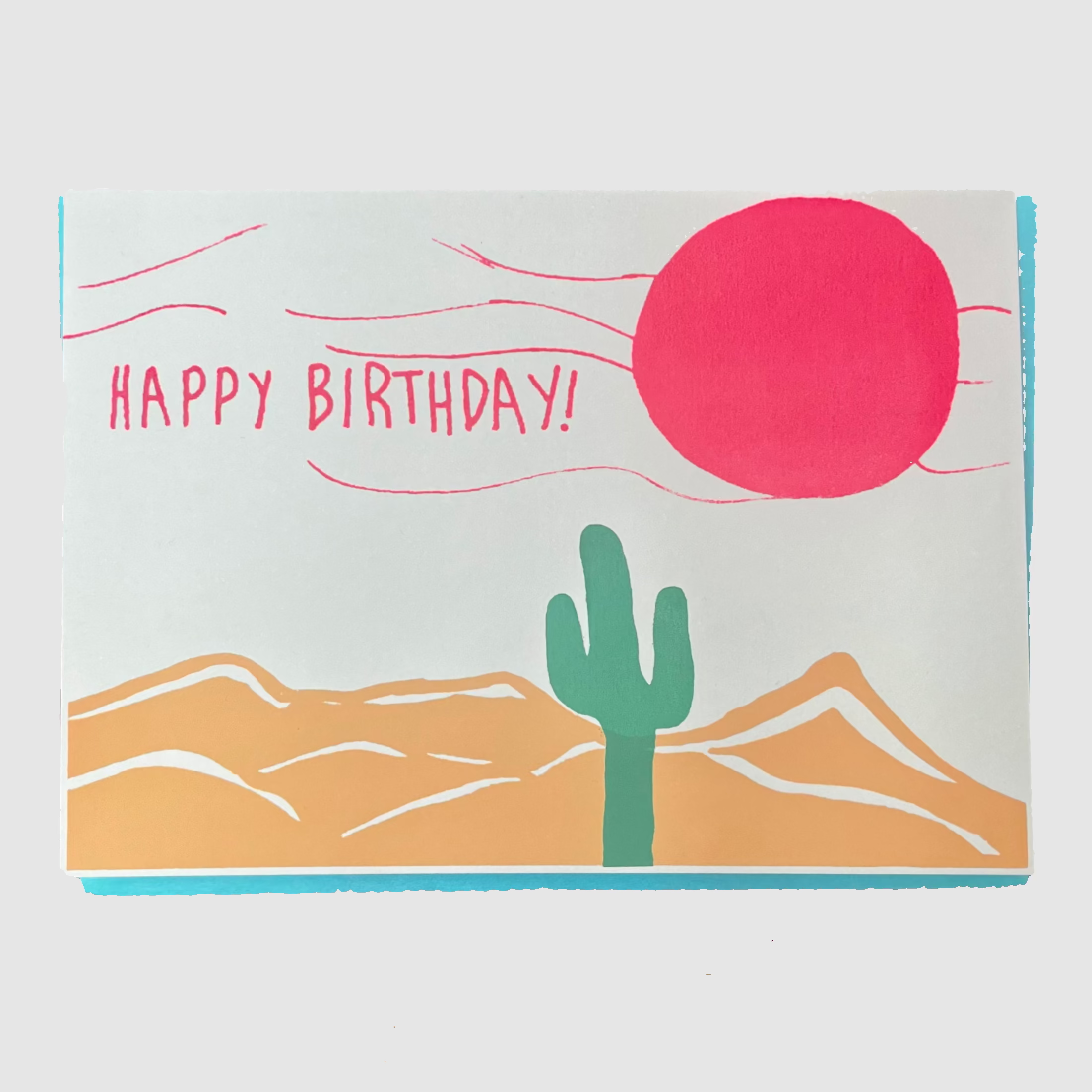 Birthday card with cactus and sun design on a light grey background