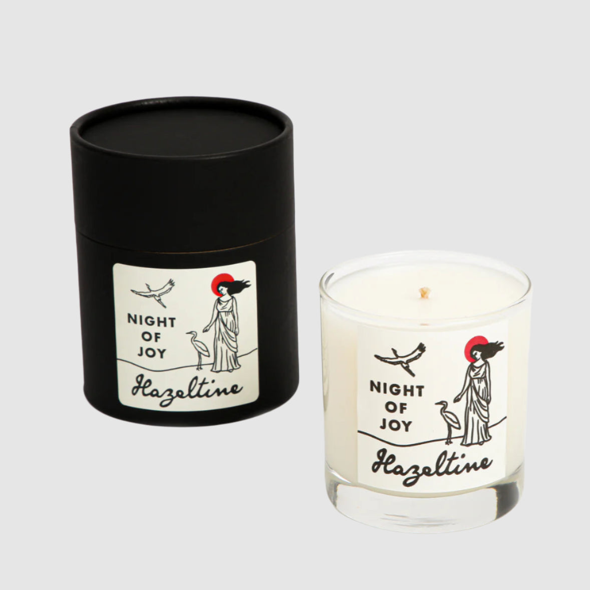 Candle labeled 'Night of Joy' by Hazeltime with a black cylindrical container on a white background