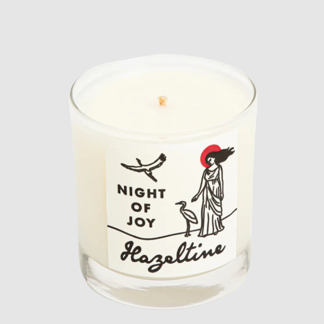 Candle with 'Night of Joy' and 'Hazeltime' text on a white background