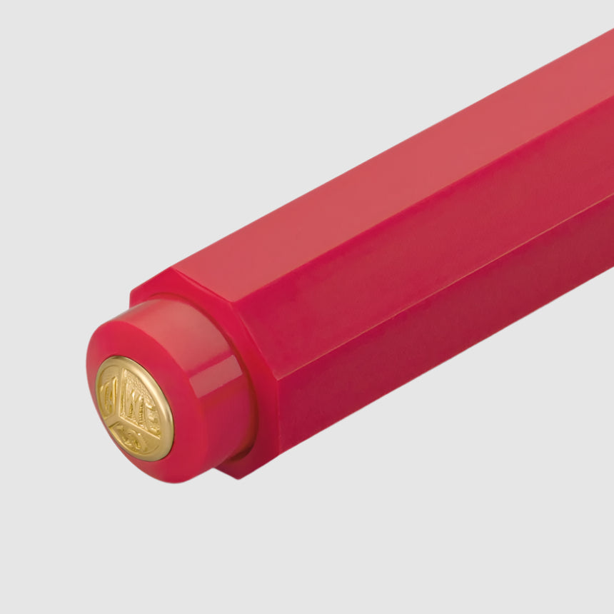 Red pen with a gold cap on a white background