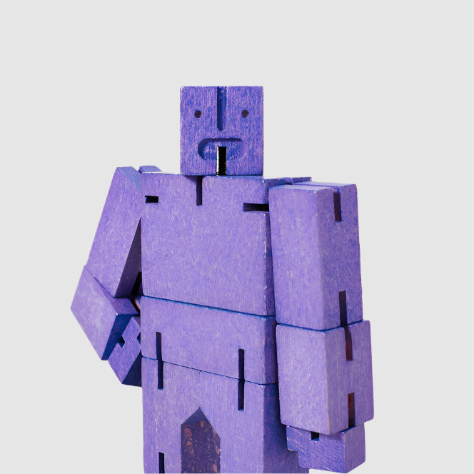Purple robot toy on a white background