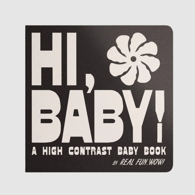 Front cover of ‘Hi, Baby!’ High Contrast Baby Book by Real Fun, Wow! Black cover with bold white lettering and flower-like symbol in corner. Reads, "HI, BABY! A HIGH CONTRAST BABY BOOK BY REAL FUN.WOW!"
