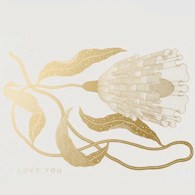 Front view of a white and gold greeting card with a. floral abstract design and "I LOVE YOU" in gold foil.