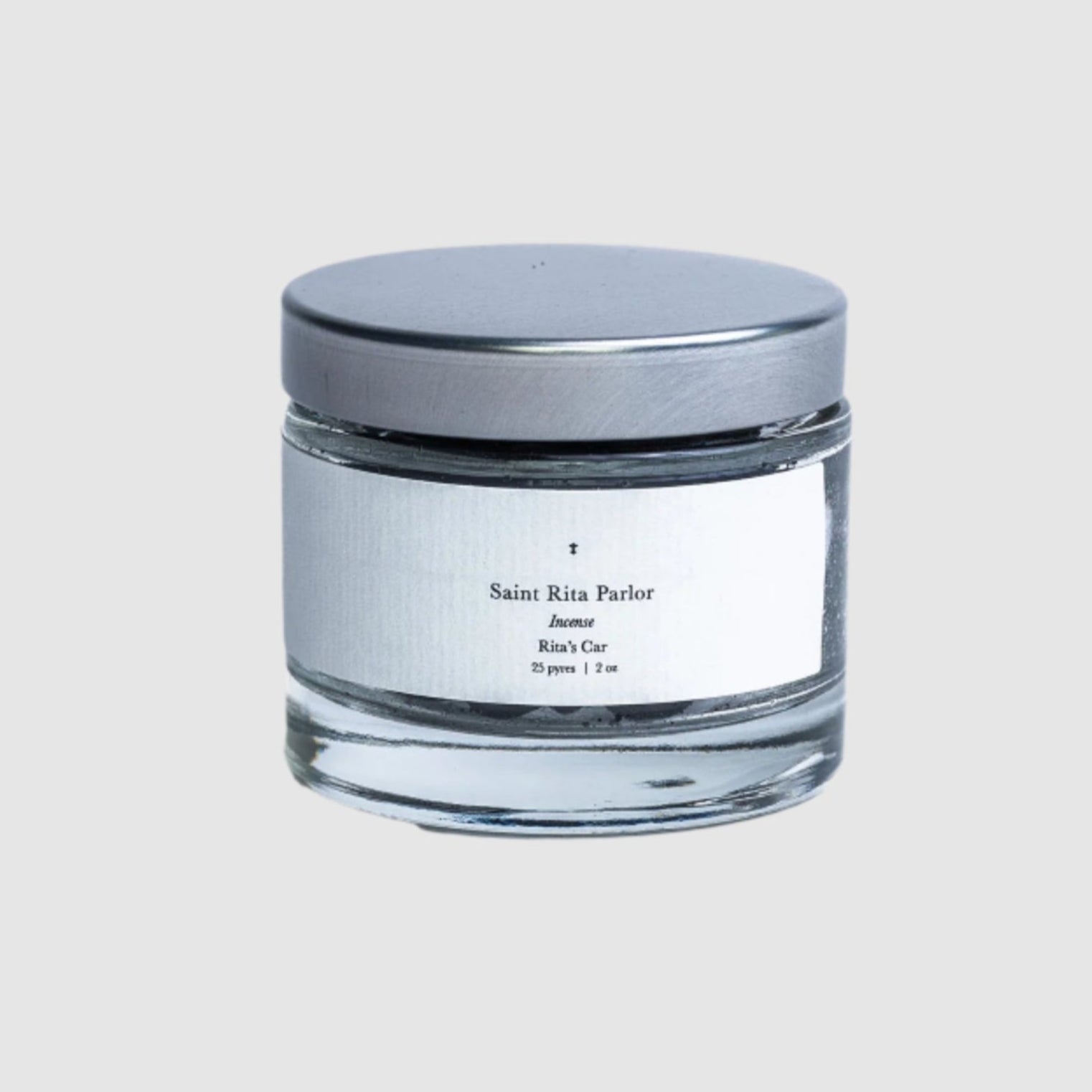 A jar of Saint Rita Parlor Incense on a blank grey background