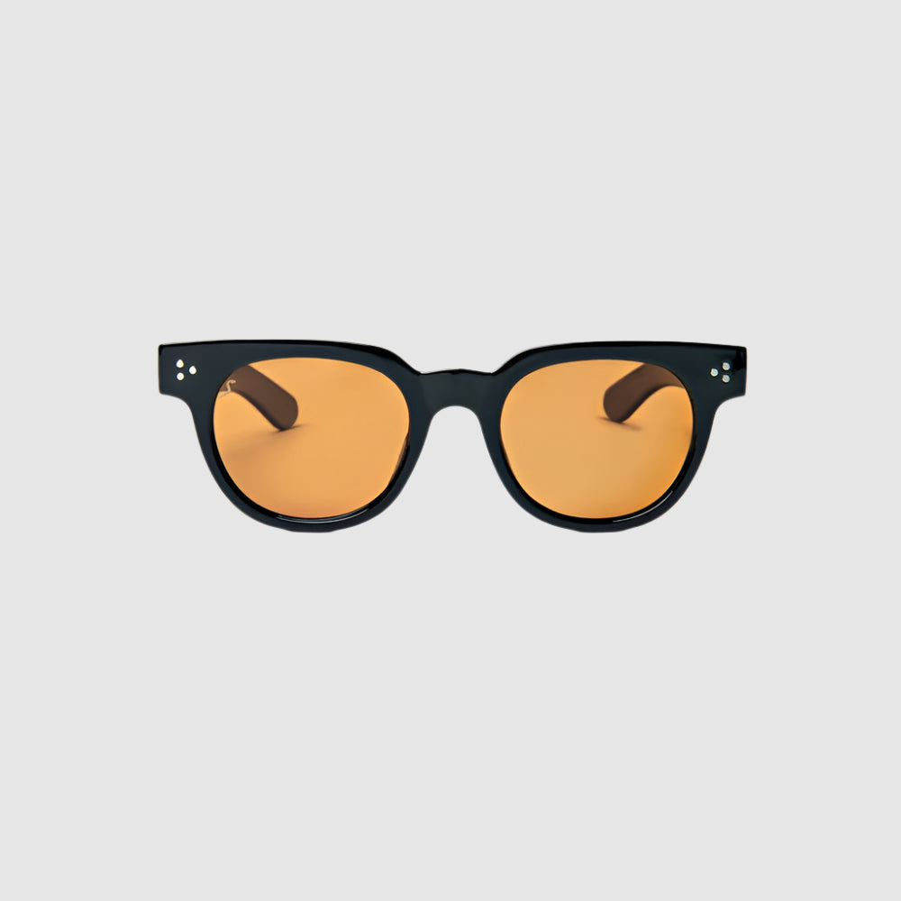 Front view of black and amber, 'Human Being' style, Shady Spex sunglasses on a light grey background.