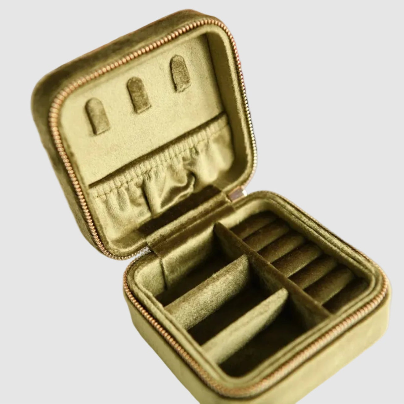 Olive, velvet, Cecelia Designs jewelry travel case with compartments for rings, bracelets, necklaces, on a light background. The perfect, unique gift for a jewelry lover.