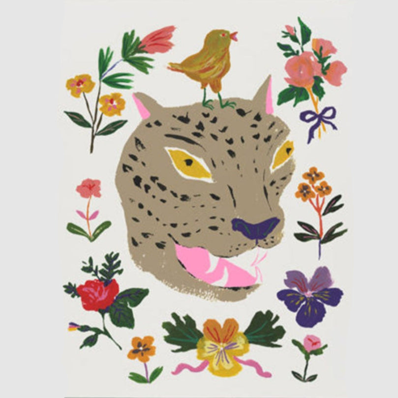 Front view of a red cap greeting card with colorful illustrations of flowers, a bird, and the head of a leopard.
