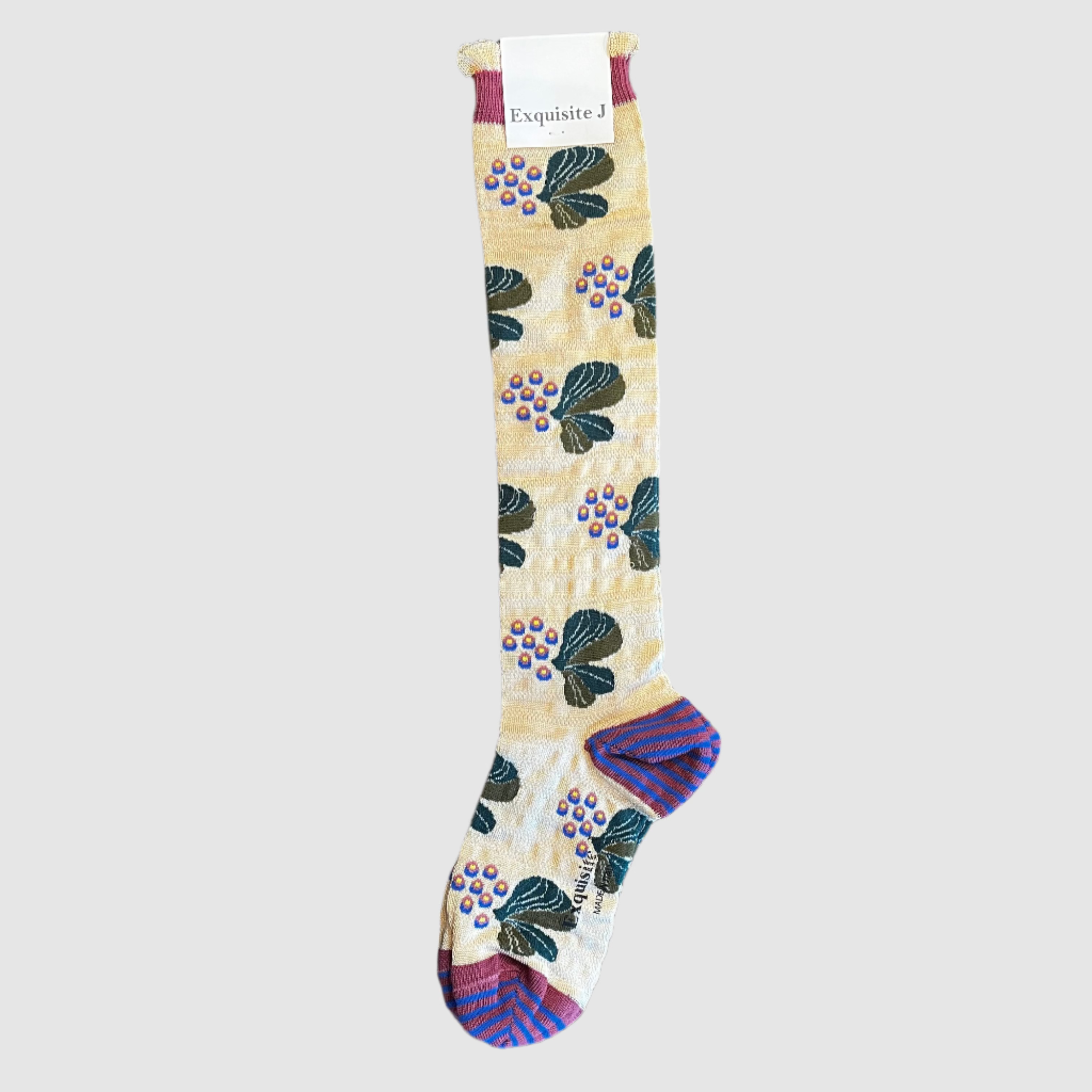 Decorative sock with floral pattern on a light grey background