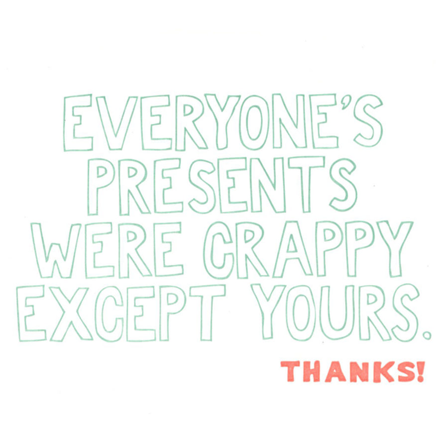 Card with humorous text 'Everyone's presents were crappy except yours. Thanks!' on a white background with a brown envelope.