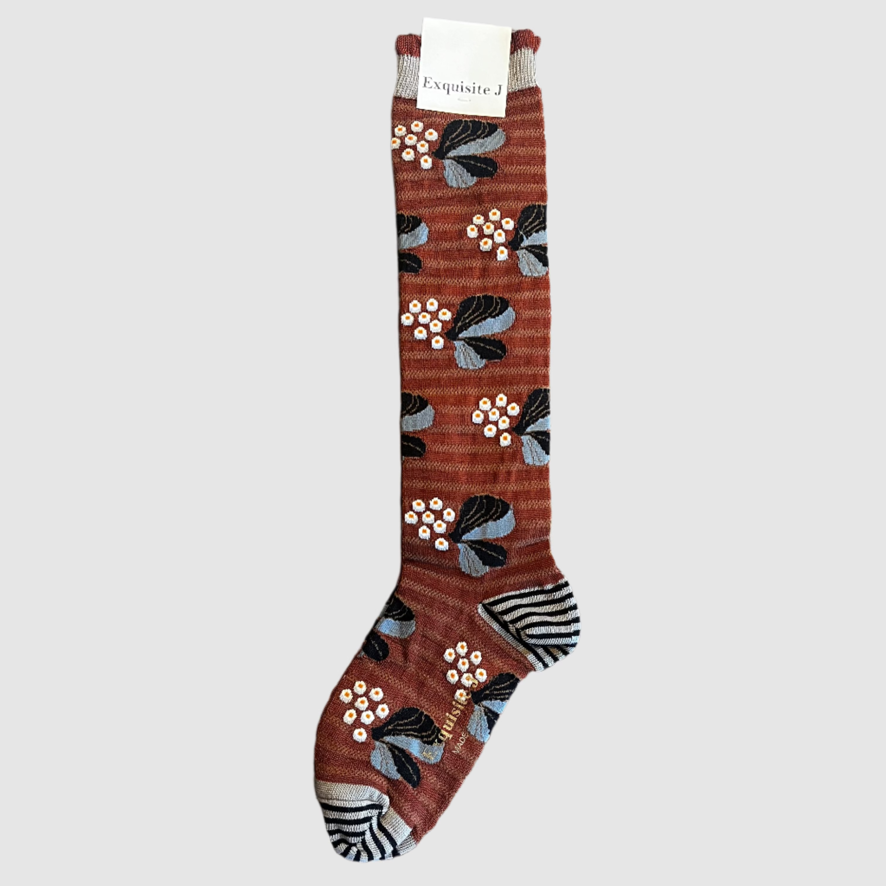 Decorative stocking with floral pattern on a light grey background
