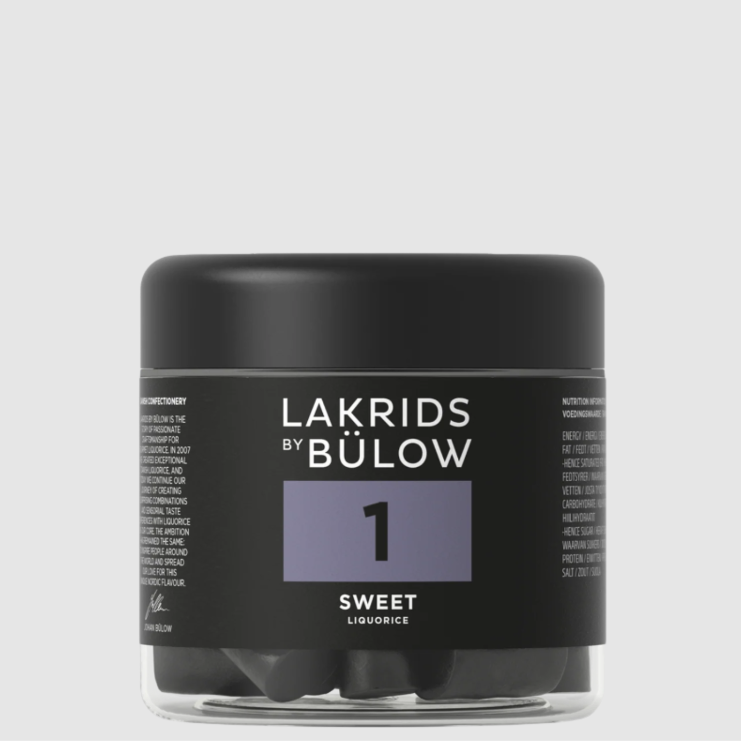 A container of Lakrids by Bulow 1-Sweet flavored licorice pieces on a grey background.