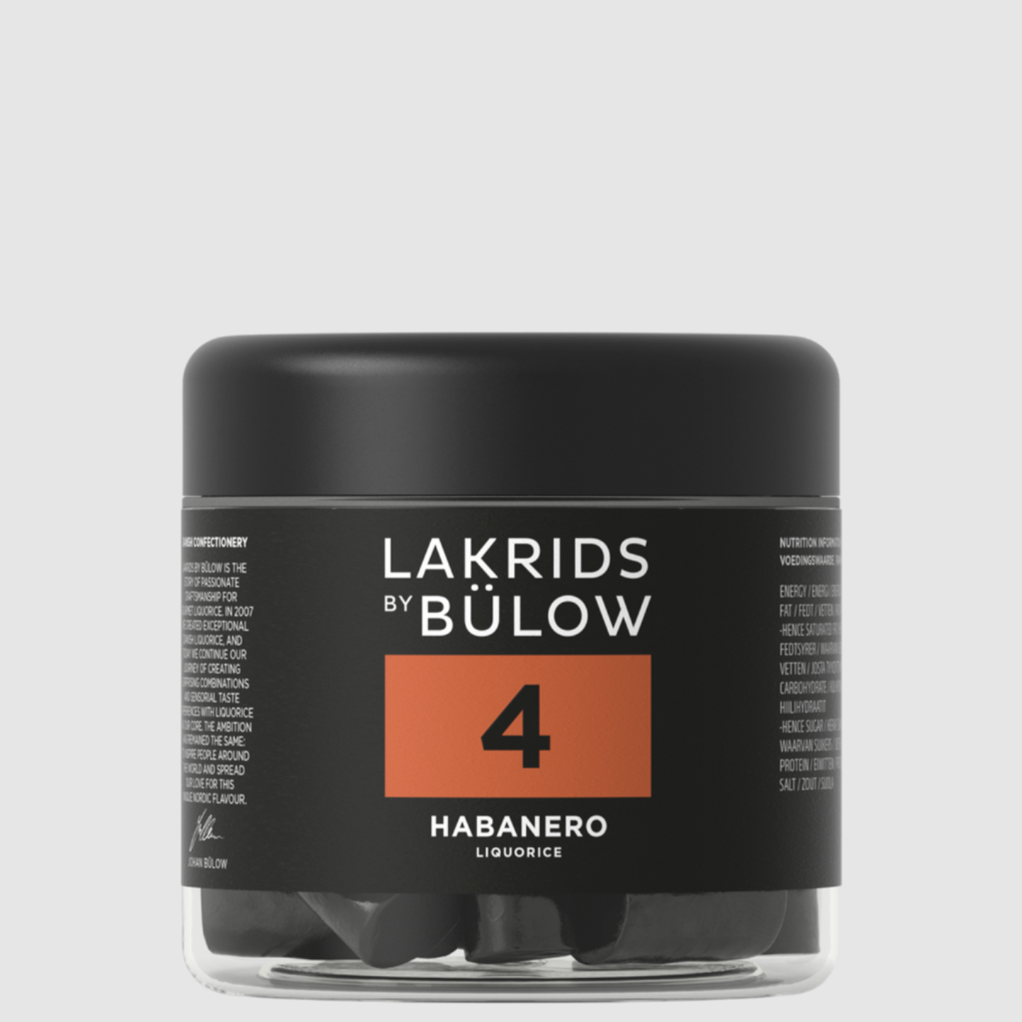 A container of Lakrids by Bulow 4-Habanero flavored licorice pieces on a grey background.