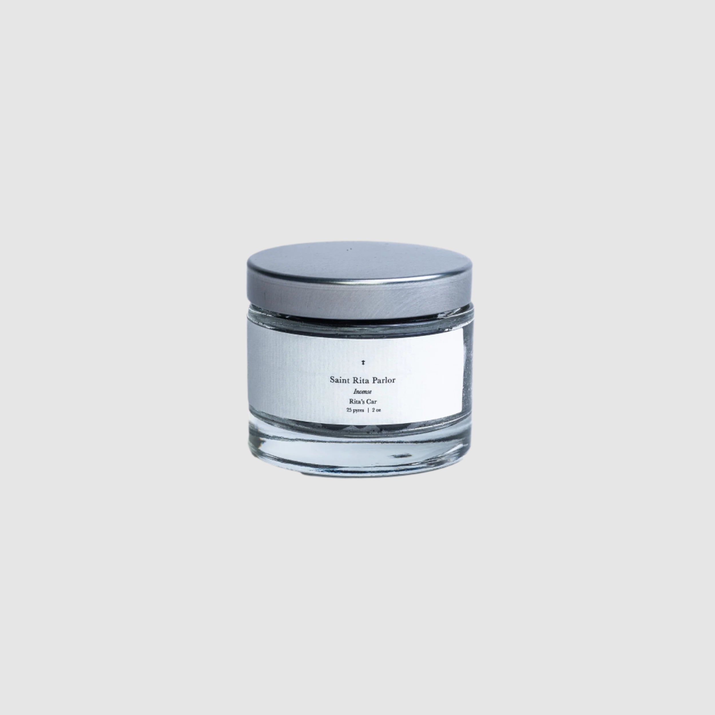 A jar of Saint Rita Parlor Incense on a blank grey background