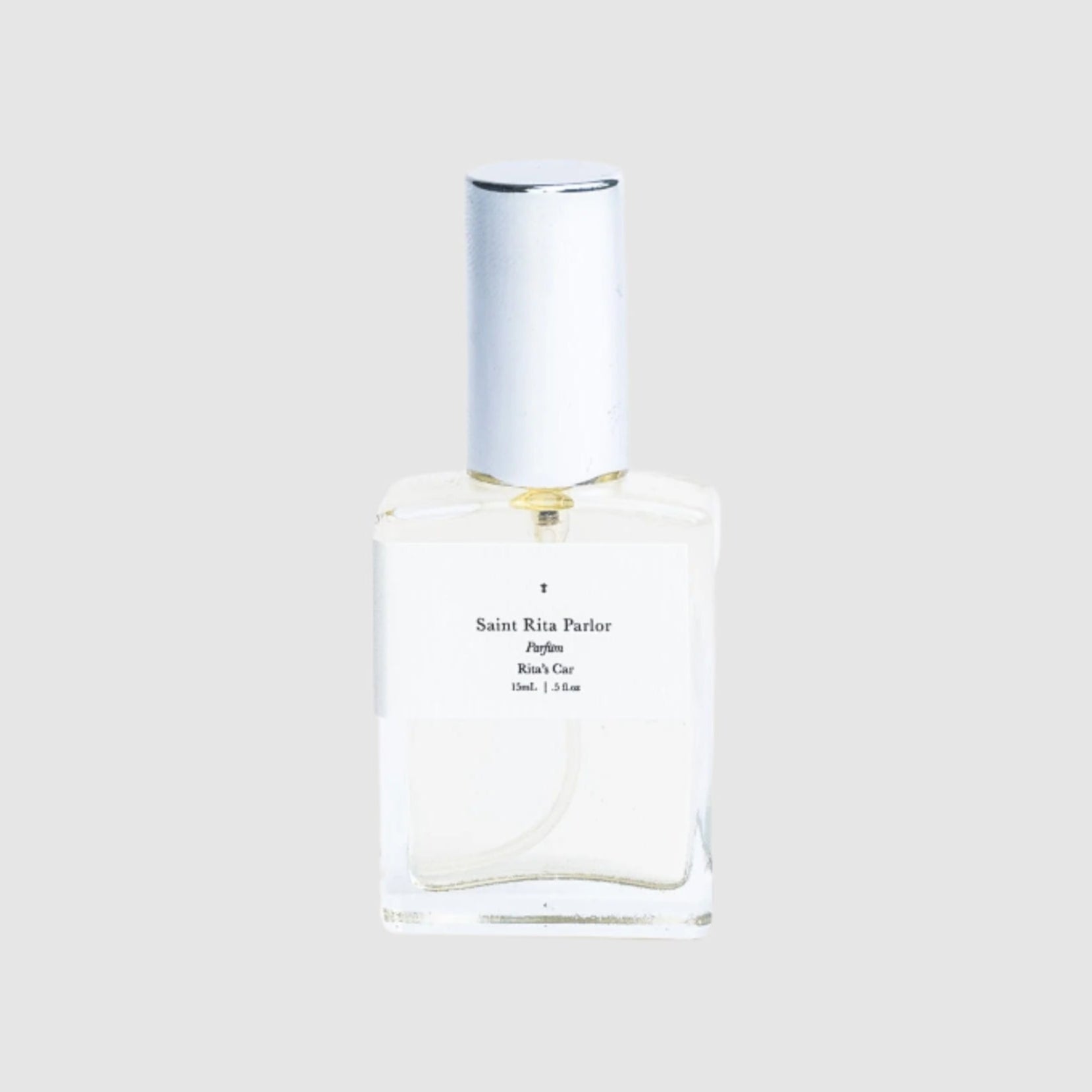 Perfume bottle with white label on a light gray background