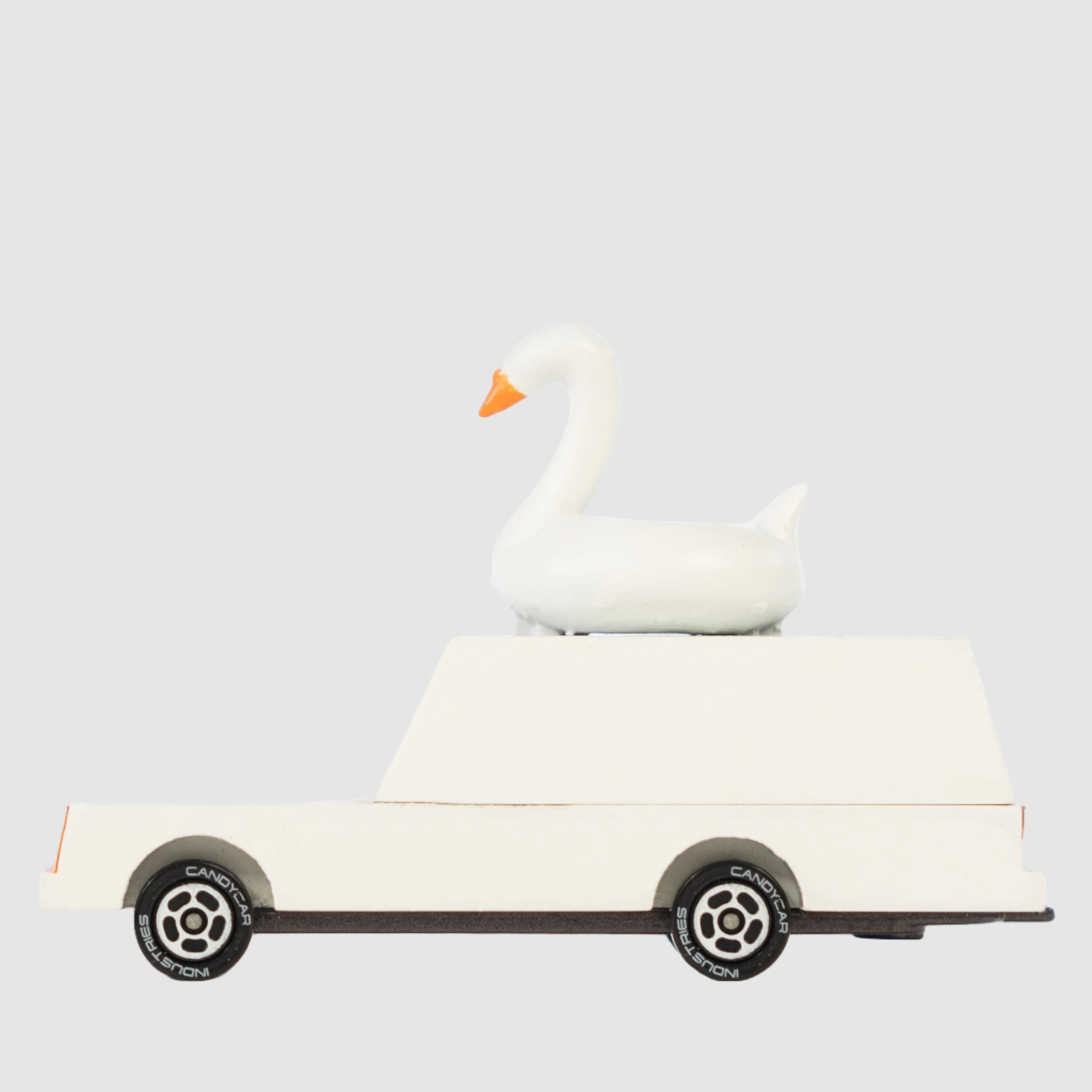 wooden white sawn wagon toy car handmade from Candylab Cars on a light grey background