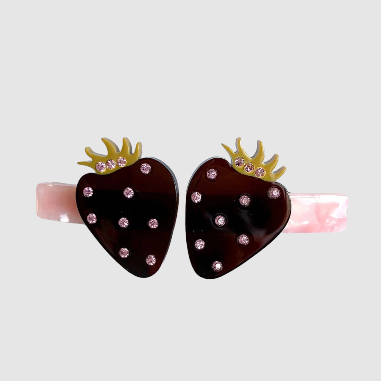 A Centinelle, strawberries styled hair barrette on a grey background