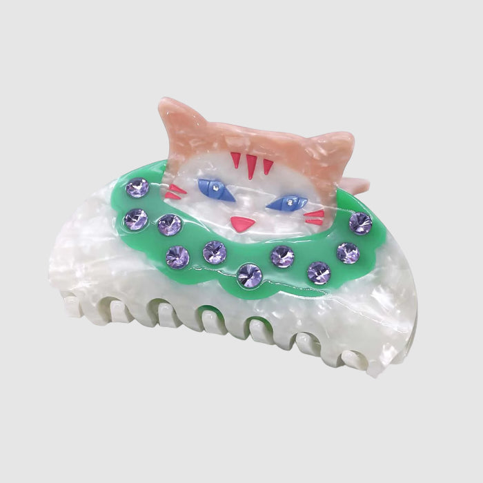 A Centinelle hair claw clip with a cat clown design on a light grey background.