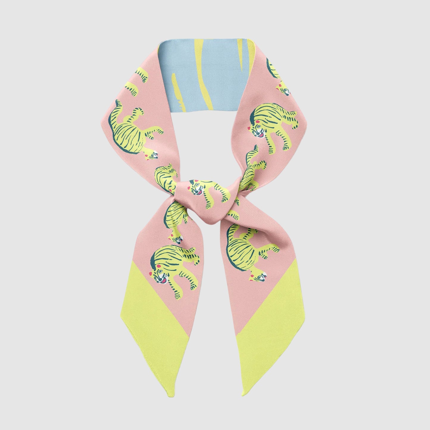 Centinelle's 'nodding tigers' twilly scarf in a knot. Light grey background.