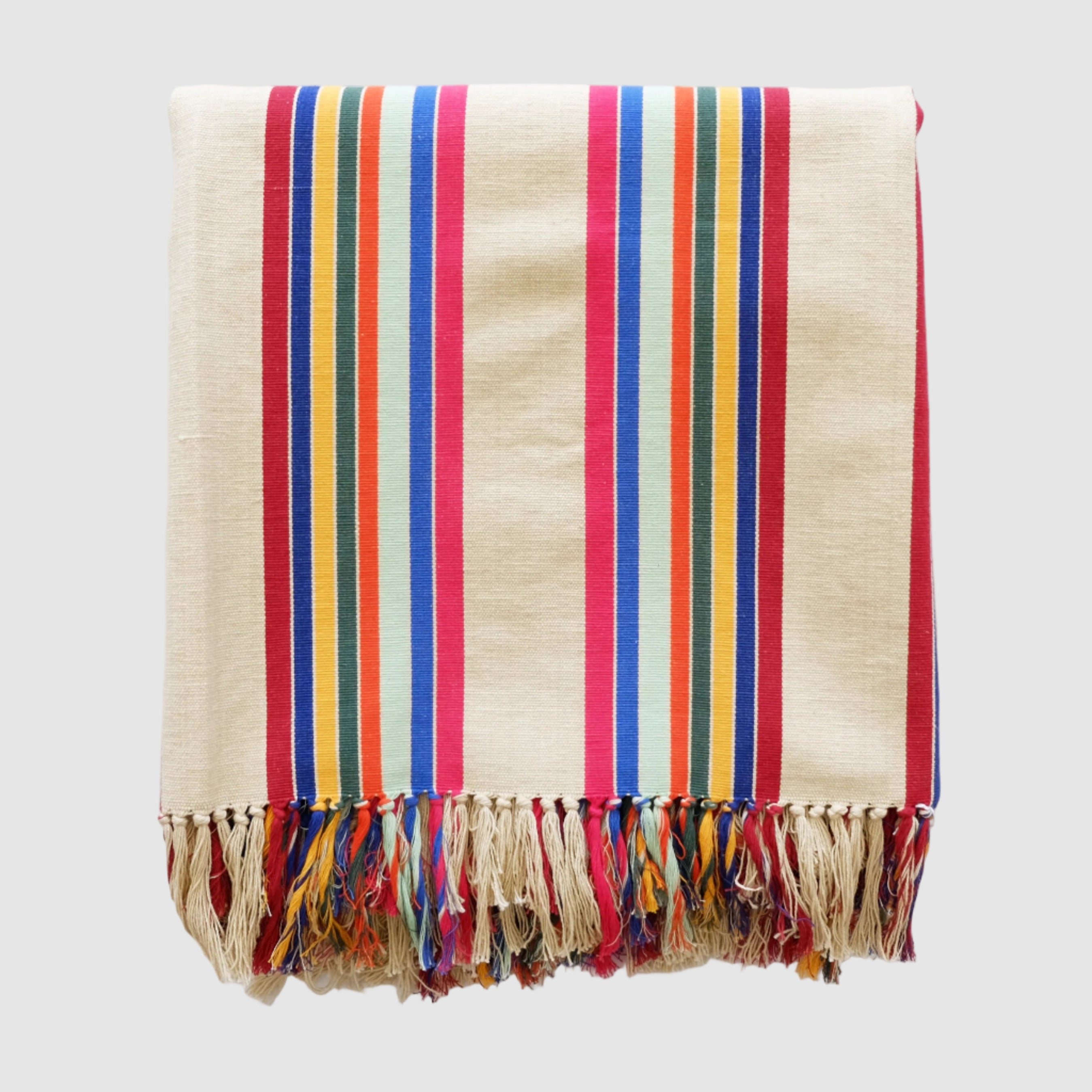 Colorful striped throw blanket with fringes on a white background