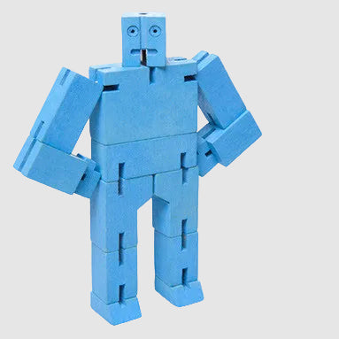 Blue robot toy made of interlocking pieces on a light gray background