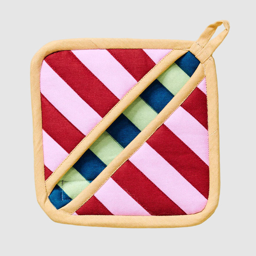 Colorful striped Dusen Dusen pot holder on a light grey background