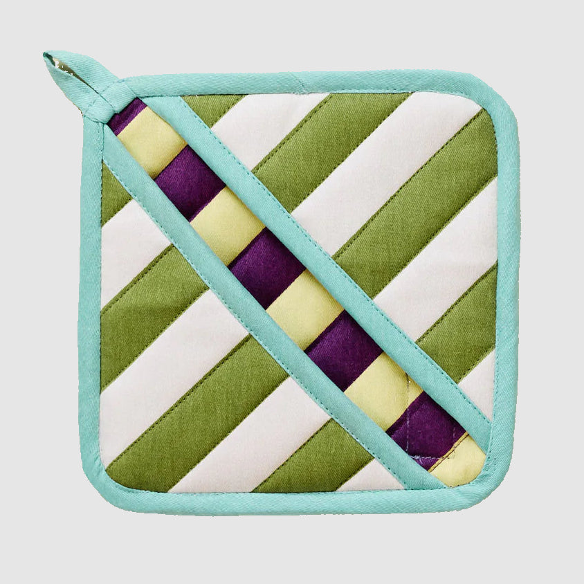Quilted DusenDusen potholder with green, purple, yellow, and white diagonal striped pattern on a light grey background